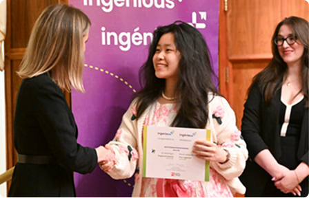Young innovator receiving a certificate